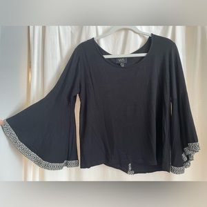 Long flare sleeve flattering blouse.